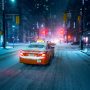 a car driving down a snow covered street at night